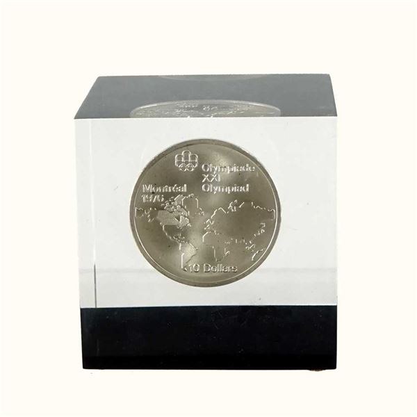 CANADA - Bloc d'acrylique contenant une piece de 10 dollars 1973 Olympiades de MontrEal