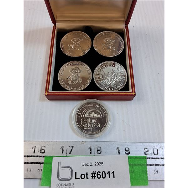 (4) Klondike Days 1973 Coins & Saskatoon 1982 Centennial Dollar Coin - CANNOT GUARANTEE AUTHENTICATI