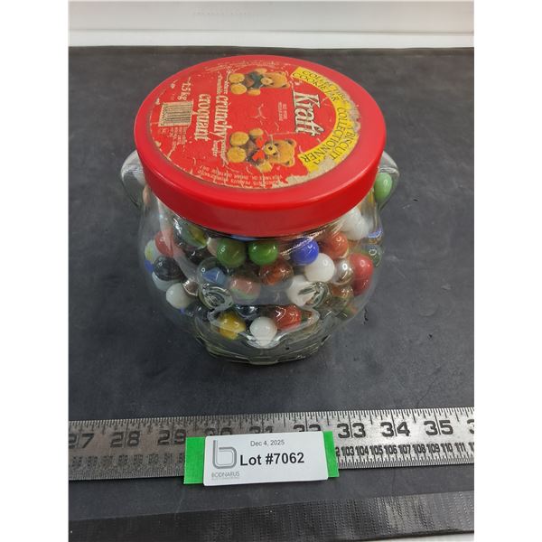 Large Quantity of Glass Marbles in Kraft Peanut Butter Jar