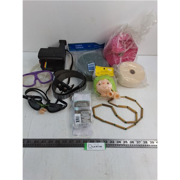 Polaroid Camera, Party Streamers, Water Goggles, Doll Head, Belt, Candles, Misc.