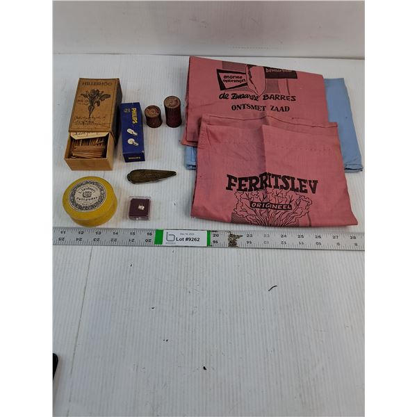 (3) Small Burlap Sacks,Pocket Knife,Match Box,(2) Bandage Tins,Bulb,Charm and Makeup Powder Tin