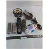 Image 1 : (4) TV Remotes, Las Vegas Coin Bank, Grocery Cart Wheel, Video Game Controller