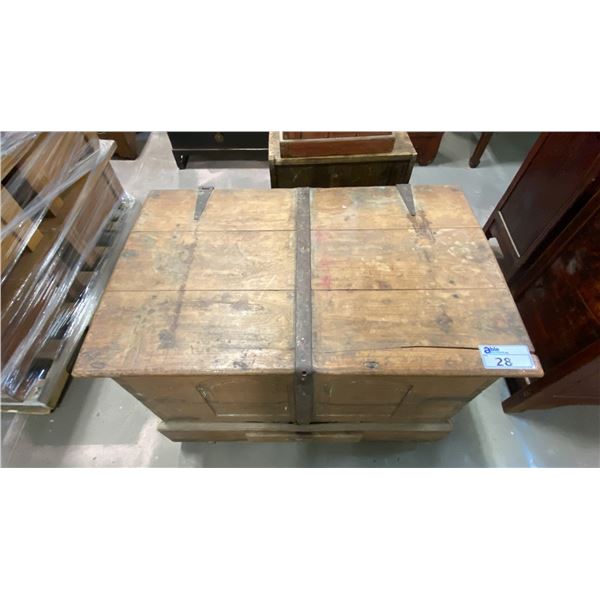 ANTIQUE WOODEN DOVETAILED STEAMER TRUNK WITH IRON ACCENTS AND ROUND WOODEN WHEELS