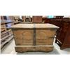 Image 2 : ANTIQUE WOODEN DOVETAILED STEAMER TRUNK WITH IRON ACCENTS AND ROUND WOODEN WHEELS