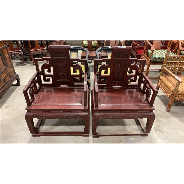 PAIR OF CARVED HARDWOOD ASIAN ARM CHAIRS WITH FLYING BATS AND DRAGONS MOTIF,