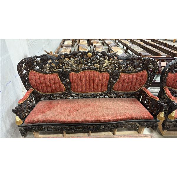 HEAVILY CARVED UPHOLSTERED ASIAN COUCH WITH DRAGON MOTIF ON PLYWOOD BASE