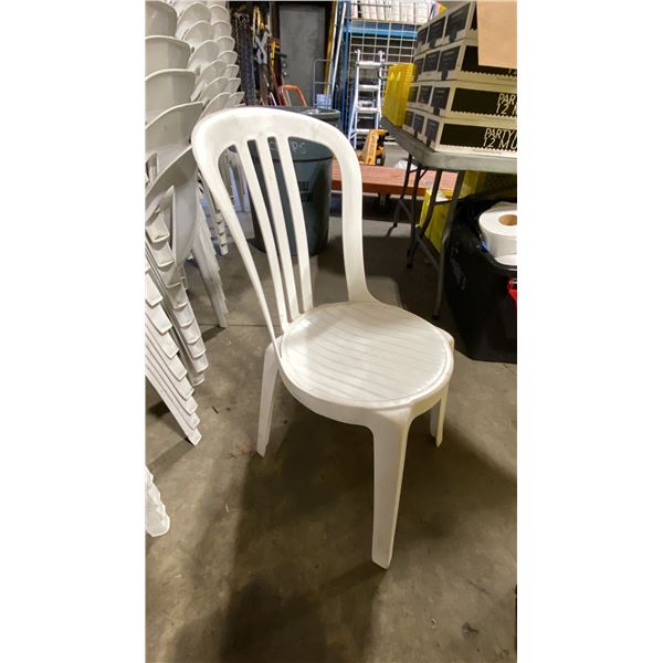 STACK OF 25 WHITE PLASTIC OUTDOOR SLAT BACK EVENT STACKING CHAIRS