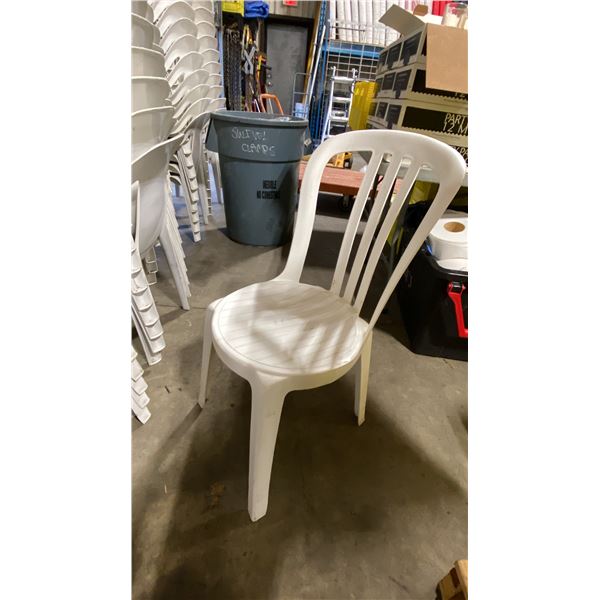 STACK OF 25 WHITE PLASTIC OUTDOOR SLAT BACK EVENT STACKING CHAIRS