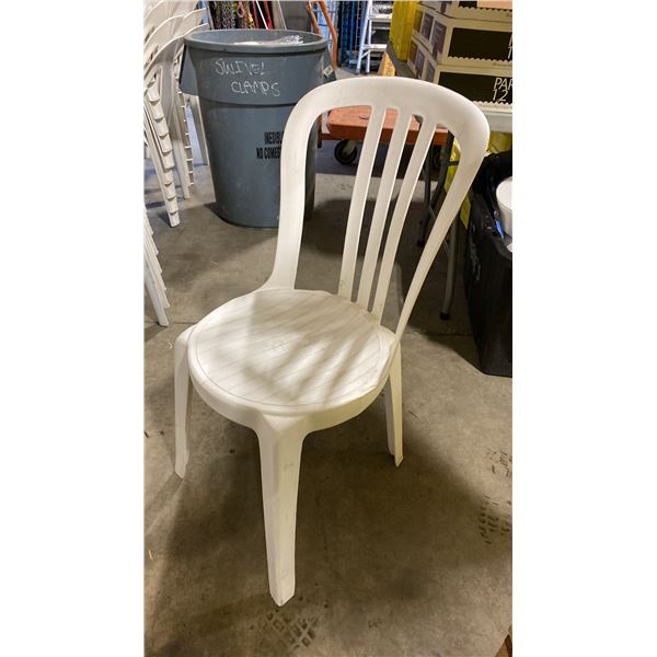 STACK OF 25 WHITE PLASTIC OUTDOOR SLAT BACK EVENT STACKING CHAIRS
