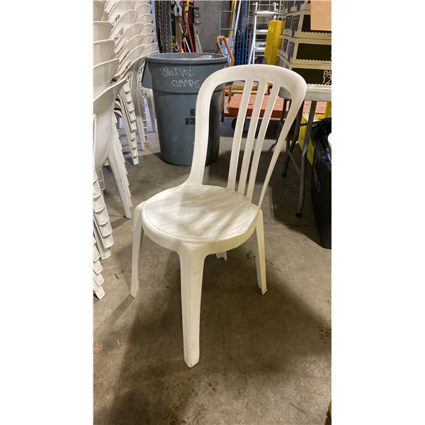 STACK OF 25 WHITE PLASTIC OUTDOOR SLAT BACK EVENT STACKING CHAIRS