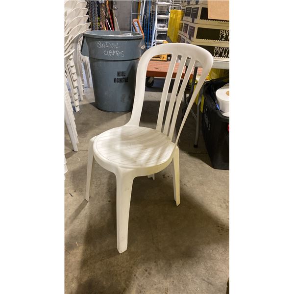 STACK OF 25 WHITE PLASTIC OUTDOOR SLAT BACK EVENT STACKING CHAIRS