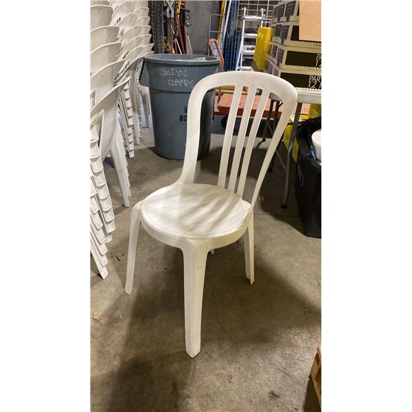 STACK OF 25 WHITE PLASTIC OUTDOOR SLAT BACK EVENT STACKING CHAIRS