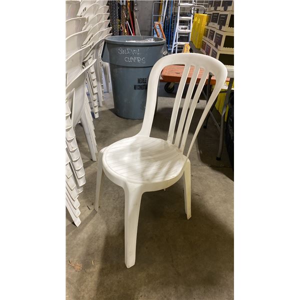 STACK OF 25 WHITE PLASTIC OUTDOOR SLAT BACK EVENT STACKING CHAIRS