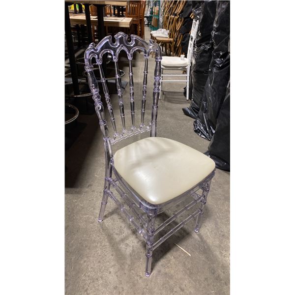 STACK OF 8 CLEAR PLASTIC COMMERCIAL STACKING EVENT CHAIRS WITH CUSHIONS