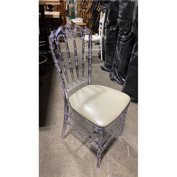 STACK OF 8 CLEAR PLASTIC COMMERCIAL STACKING EVENT CHAIRS WITH CUSHIONS