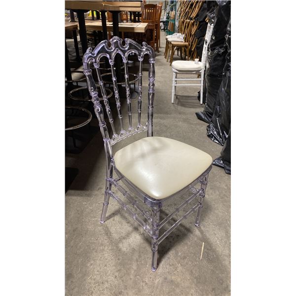 STACK OF 8 CLEAR PLASTIC COMMERCIAL STACKING EVENT CHAIRS WITH CUSHIONS