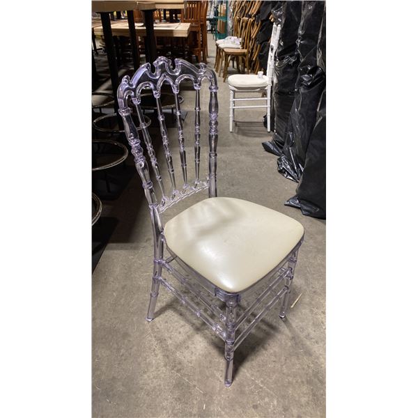 STACK OF 8 CLEAR PLASTIC COMMERCIAL STACKING EVENT CHAIRS WITH CUSHIONS