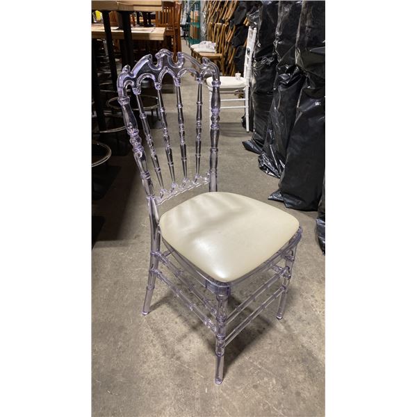 STACK OF 8 CLEAR PLASTIC COMMERCIAL STACKING EVENT CHAIRS WITH CUSHIONS
