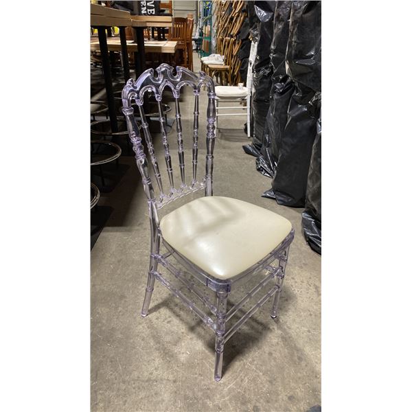 STACK OF 8 CLEAR PLASTIC COMMERCIAL STACKING EVENT CHAIRS WITH CUSHIONS
