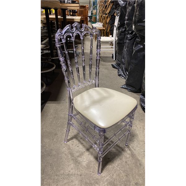 STACK OF 8 CLEAR PLASTIC COMMERCIAL STACKING EVENT CHAIRS WITH CUSHIONS