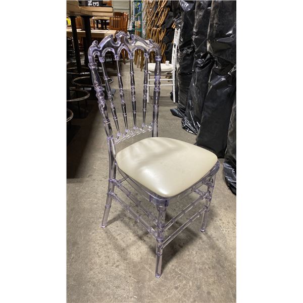 STACK OF 8 CLEAR PLASTIC COMMERCIAL STACKING EVENT CHAIRS WITH CUSHIONS