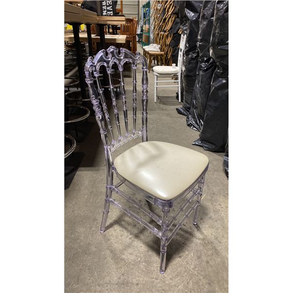 STACK OF 8 CLEAR PLASTIC COMMERCIAL STACKING EVENT CHAIRS WITH CUSHIONS