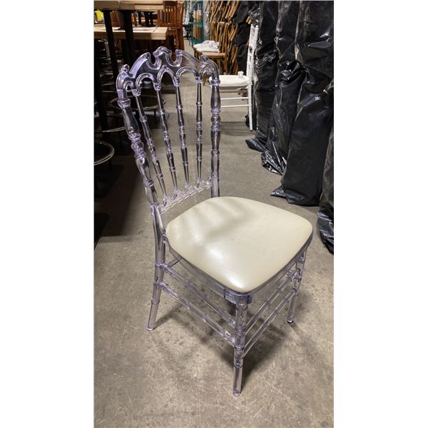 STACK OF 8 CLEAR PLASTIC COMMERCIAL STACKING EVENT CHAIRS WITH CUSHIONS