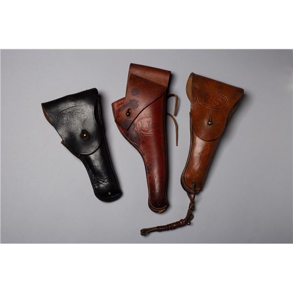 Three U.S. Stamped Holsters