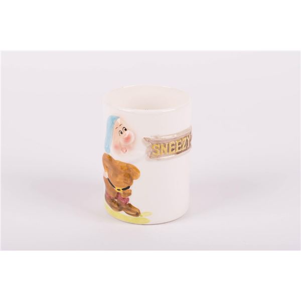 A "Snow White" Sneezy Ceramic Cup.