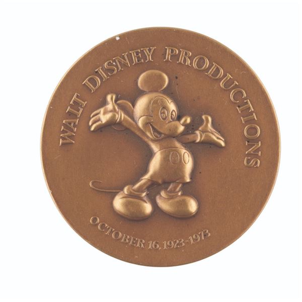 A Walt Disney Productions 50th Anniversary Coin.