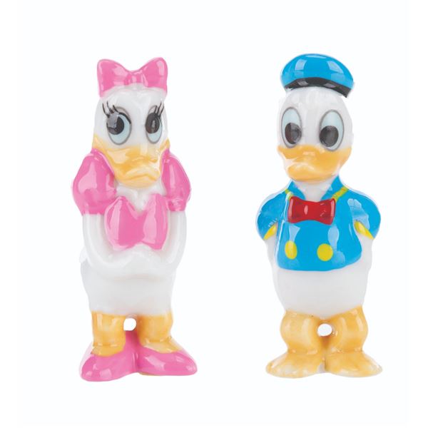 A Pair of Donald and Daisy Duck Ceramic Figurines.