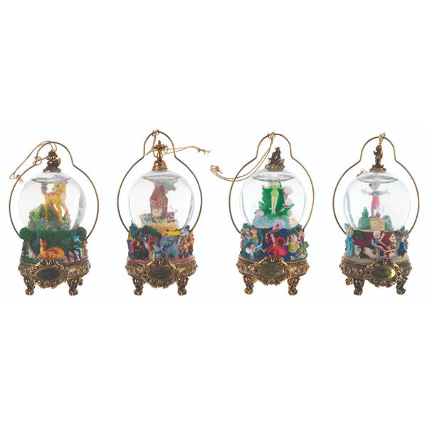 A Collection of Disney Masters Snow Globe Ornaments.