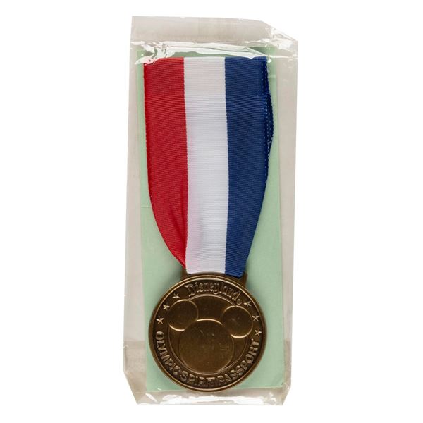 A Disneyland Olympic Spirit Passport Medal.