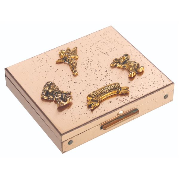 A Metal Disneyland Powder Compact.