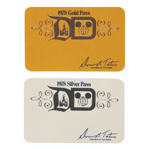 A Pair of Unused Gold and Silver Disney Park Passes.