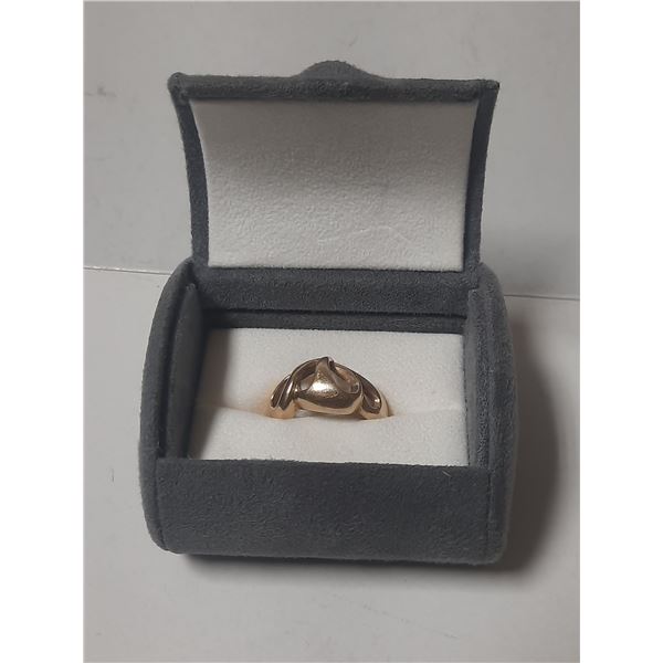 This Ring was a special design made by bench Jeweller's in Kamloops, B.C. using 10-14KT gold melted 
