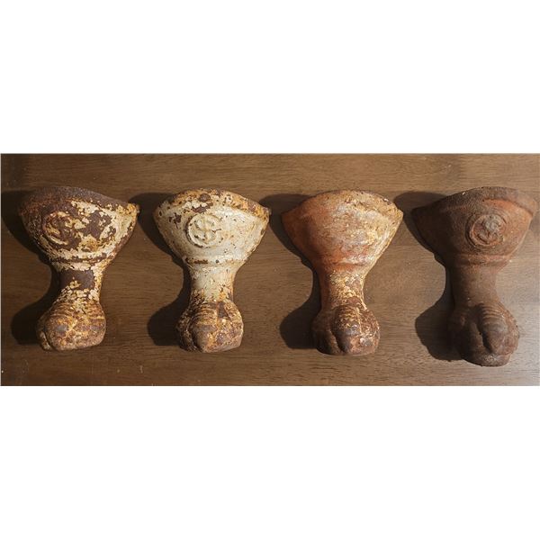 Four cast iron, eagle talon, bathtub feet