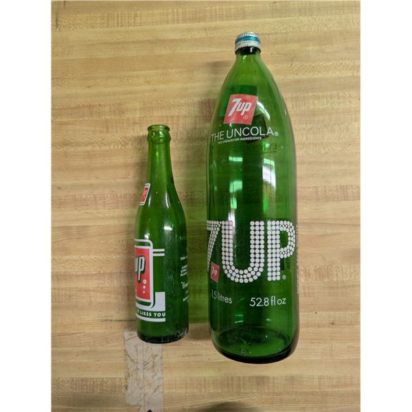 (2) Vintage 7UP Bottles (1) 1.5 Litre Bottle w/ Lid and (1) Regular