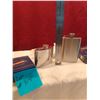 Image 2 : Lot # 915 Two elegant stainless steel pocket flasks are offered for auction: a classic rectangular m