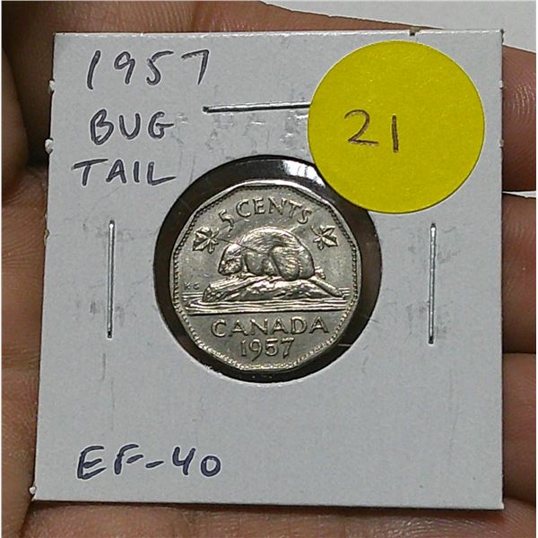 1957 Canadian Bug Tail Nickel 5 Cents. There is a small Die Chip on the end of the Beaver’s