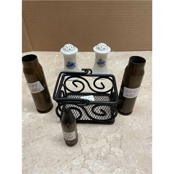 Two Empty Shell Casing and one Head,  Black Metal Basket,  Salt and Pepper Shakers