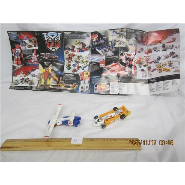 811. Two 1980's Transformers Air Bot and a Renault E1F Race Car with Brochure