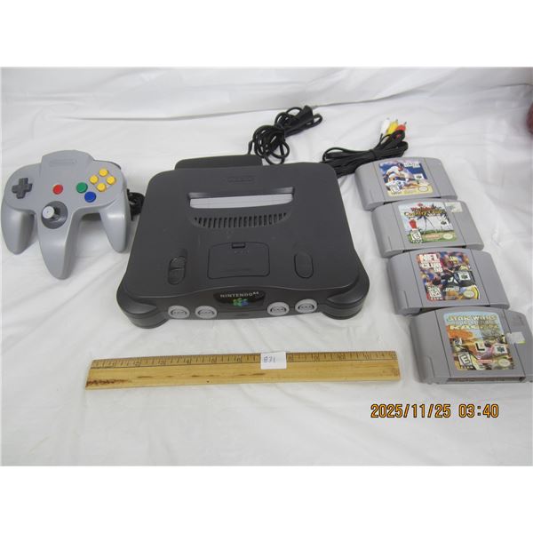 831. Nintendo N64 with Controller Deck Power Cord AV Cord Red Expansion Pack and 4 Games