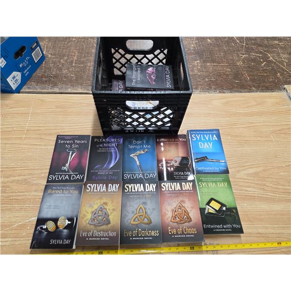 Lot of Sylvia day books and milk crate