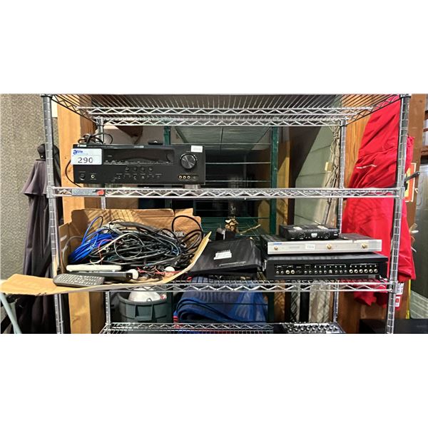 SHELF OF CABLES, REMOTES, WIFI ROUTER, WIRELESS MICROPHONE RECEIVER & MORE