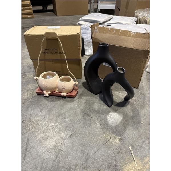 2 NEW HANGING FACE SWING PLANTERS AND NEW SET OF BLACK VASES