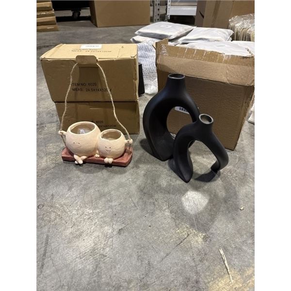 2 NEW HANGING FACE SWING PLANTERS AND NEW SET OF BLACK VASES