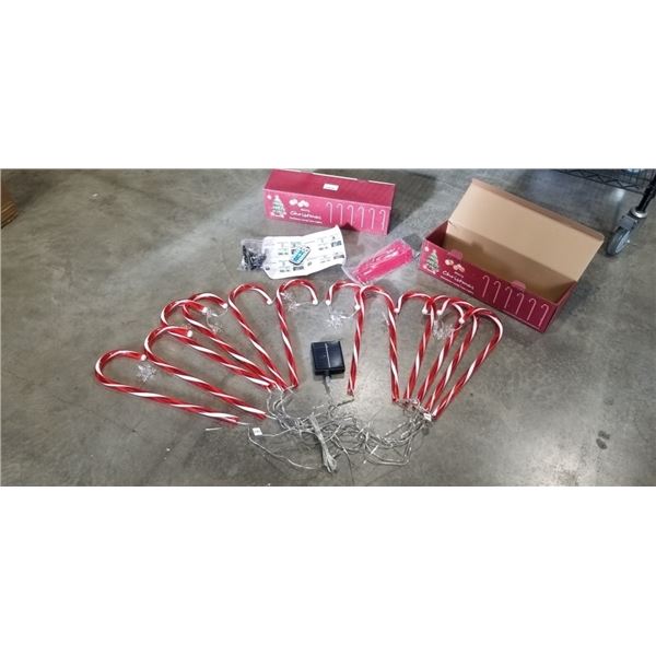 2 NEW CANDY CANE OUTDOOR SOLAR LIGHT SETS WITH REMOTE AND CUSTOMIZABLE LIGHTS APPROX 20FT, INCLUDES 