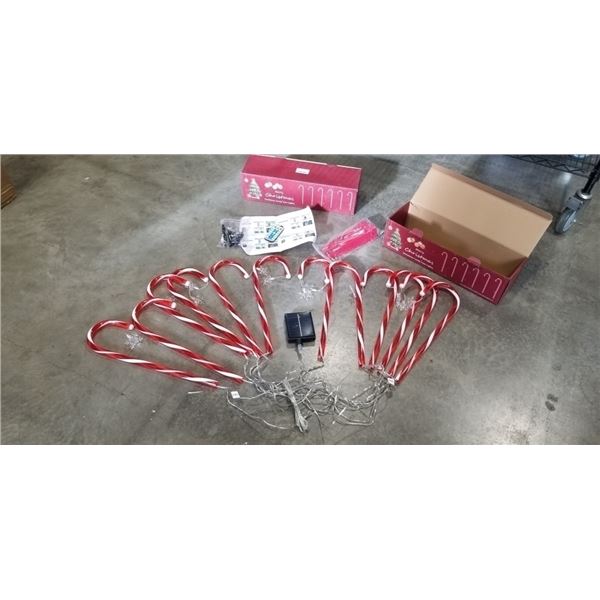 2 NEW CANDY CANE OUTDOOR SOLAR LIGHT SETS WITH REMOTE AND CUSTOMIZABLE LIGHTS APPROX 20FT, INCLUDES 