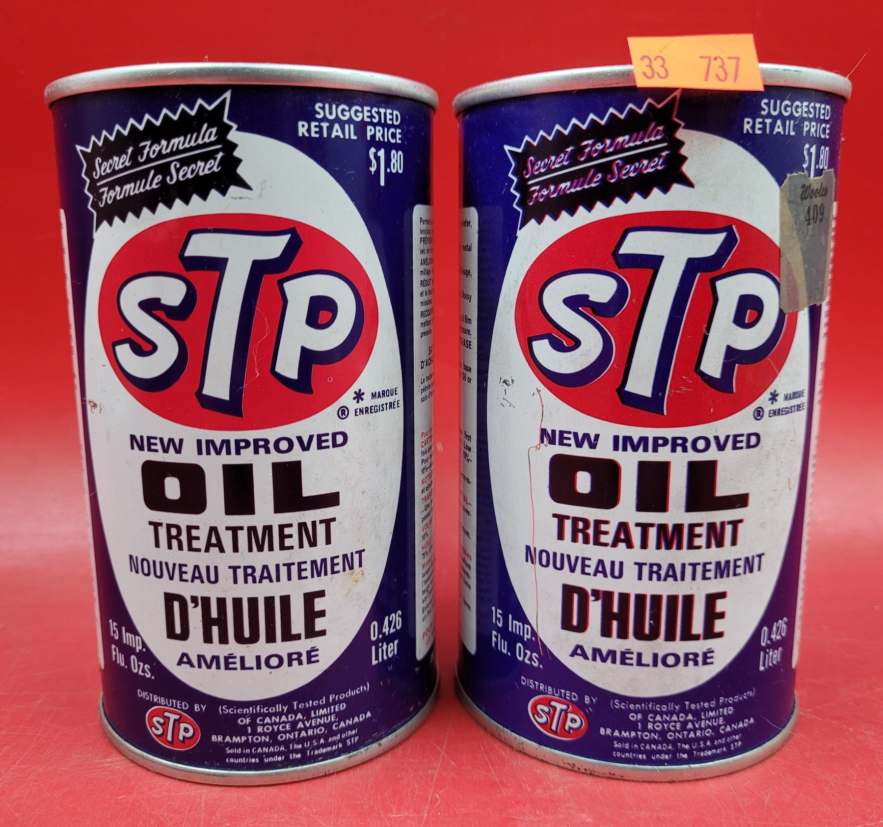 Two VTG Full STP Oil Treatment Oil Cans